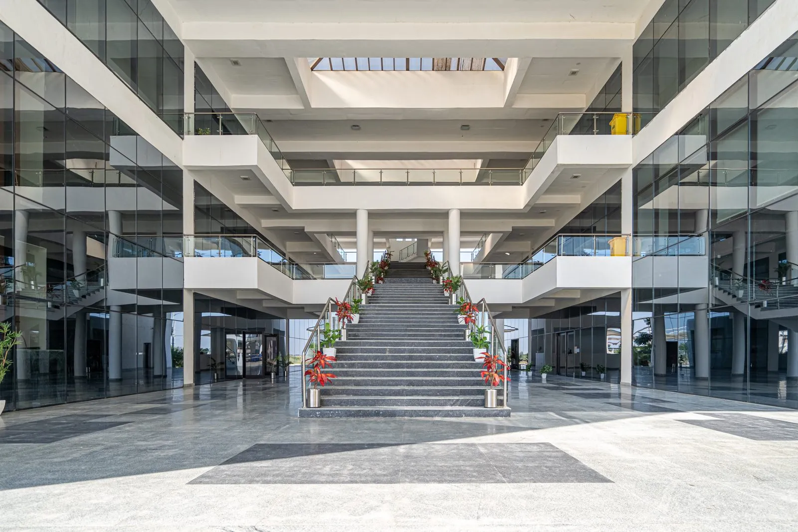 Front approach of the ABCD building in Dholera with landscaping