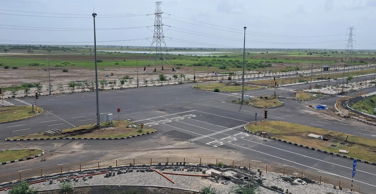 Completed arterial road with signage inside Dholera Activation Area